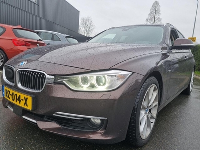 BMW 3-serie Touring 330d High Executive Leder Adaptief