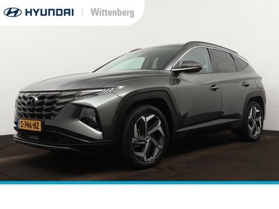 HYUNDAI TUCSON 1.6 T-GDI HEV PREMIUM | OUTLET DEAL! | TREKHAAK | LEDER | NAVI | CLIMA | CRUISE | CAMERA | KEYLESS | ELEKTR. STOELEN | STOELVENTILATIE | 19'' LMVELGEN | ELEKTRISCHE KLEP | FABRIEKSGARANTIE GELDIG T/M 2-2028! |