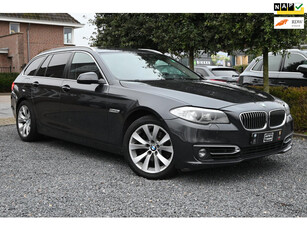 BMW 5-serie Touring 523i High Executive Trekhaak Pano Cruise Parkeersensoren