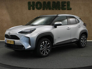 Toyota Yaris Cross 1.5 Hybrid 130 Dynamic Team D - NIEUW UIT VOORRAAD - NAVIGATIE - 17 INCH LICHT METALEN VELGEN - DRAADLOZE TELEFOONLADER - VOORSTOELEN VERWARMD - STUUR VERWARMD - VOORRUIT VERWARMD - KEYLESS ENTRY/ START - CLIMATE CONTROL - ARMSTEUN VOOR