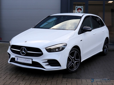 Mercedes-Benz B-Klasse 250e Business Solution | AMG | AmbienteLight | Leder | LED | MBUX | Night Paket | Parkeerassistent | Spoorassistent | Intr. Voorverwarming | Public-Charging-Pakket | Volledig Dealeronderhouden