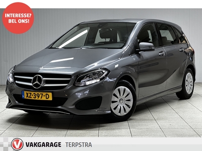 MERCEDES B-KLASSE 180 Ambition/ Automaat!/ Navi/ Airco/ Cruise/ Elek. pakket/ Isofix/ Bluetooth/ Regensenor/ Armsteun/ Multi. LEDER. Stuur/ PDC V+A/ LED Dagrijverl.