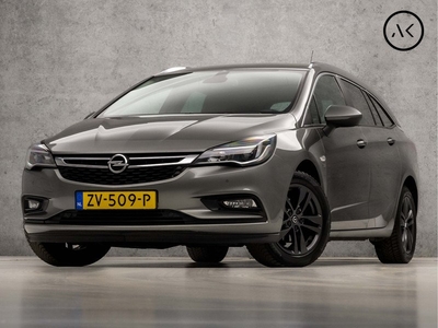 Opel Astra Sports Tourer 1.4 Turbo Sport 150Pk Automaat (APPLE CARPLAY, NAVIGATIE, TREKHAAK, GETINT GLAS, PARKEERSENSOREN, SPORTSTOELEN, CRUISE, DAB+, LM VELGEN, NIEUWSTAAT)