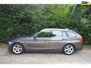 BMW 3-serie Touring 328i High Exe trekhaak/memory/camera