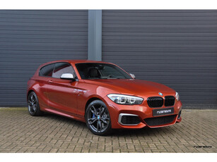 BMW 1-serie M140i LCI2 | Navi Pro | Camera | HK | Stuurverwarming | 3-deurs | Sunset Orange | 2e eig