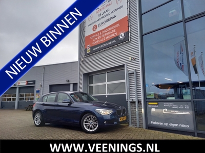 BMW 1-SERIE 116i High Executive - GROOT NAVI - LEER + STL VERWARMING - XENON - PDC - CLIMA - CRUISE - 17INCH -