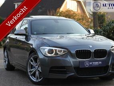 BMW 1-SERIE M135i xDrive 378 pk H&K PANO Keyless Camera Leer