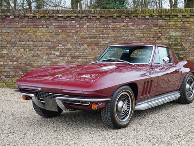 Chevrolet Corvette C2 Coupe 427 Extensive frame-off restoration fully captured in photographs, Finished in Milano Maroon over black vinyl upholstery, Fitted with Turbine-style 15″ knock-off wheels, Powered by the 