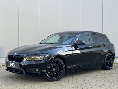 BMW 1-serie 116i Centennial High Executive - M-Sport - Airco - Cruise - Stoelverwarming - Black on Black - Camo