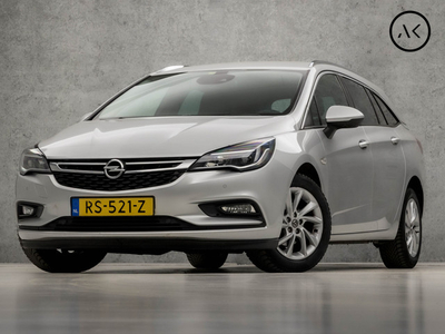 Opel Astra Sports Tourer 1.0 Luxury Sport (APPLE CARPLAY, NAVIGATIE, CAMERA, LEDER, CLIMATE, SPORTSTOELEN, GETINT GLAS, LANE ASSIST, ELEK ACHTERKLEP, XENON, CRUISE, NIEUWE APK, NIEUWSTAAT)