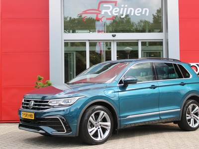 VOLKSWAGEN TIGUAN 1.4 TSI eHybrid 245PK AUTOMAAT R-LINE BUSINESS + | WEGKLAPBARE TREKHAAK | STOEL/STUUR VERWARMING | NAVIGATIE | APPLE CARPLAY/ANDROID AUTO | ADAPTIVE CRUISE | DODEHOEK BEWAKING | ACHTERUITRIJ CAMERA | ELEKTRISCH BEDIENBARE ACHTERKLEP | IQ LED KOPLAMPEN |