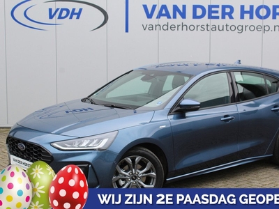 Ford Focus Hatchback 1.0-125pk EcoBoost Hybrid ST Line. Garantie t/m 02-03-2027 ! Slechts 7.100km ! Volautm. airco, metallic lak, navigatie, telefoonvoorb., B&O soundsyst., stoel-, stuur- en voorraamverwarming, side- en laneassist, camera, LM wielen, deur