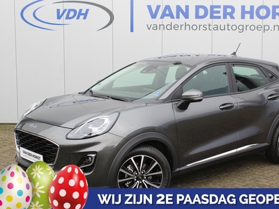 Ford Puma 1.0-125pk EcoBoost Hybrid Titanium. Garantie t/m 21-05-2027 ! Slechts 10.850km ! Volautm. airco, metallic lak, stoel-, stuur- en voorraamverwarming, navigatie, telefoonvoorbereiding, elektrische achterklep, cruise cntrl, keyless entry / keyless